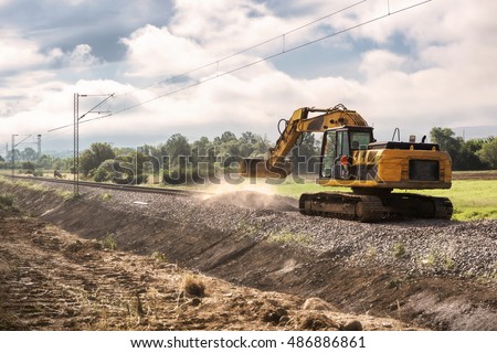 Repairing the railway line -Excavators on reconstruction of the railway rails