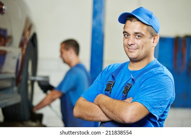 repairman auto mechanic Portrait in car auto repair or maintenance shop service station - Shutterstock ID 211838554