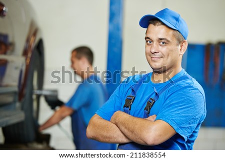 repairman auto mechanic Portrait in car auto repair or maintenance shop service station
