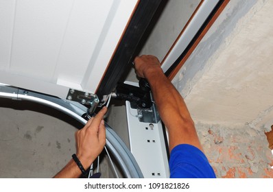 Repairman Repair Garage Door Opener. Garage Door Replacement, Garage Door Repair. 