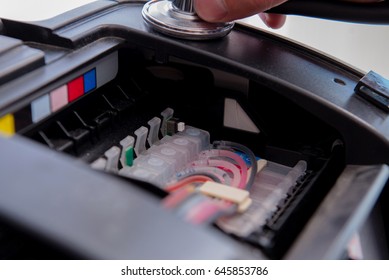 Repairman Repairing Broken Color Printer