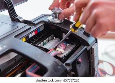 Repairman Repairing Broken Color Printer