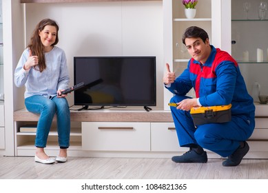 Repairman Repairing Tv At Home