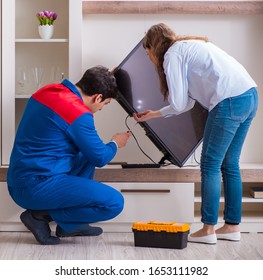 Repairman Repairing Tv At Home