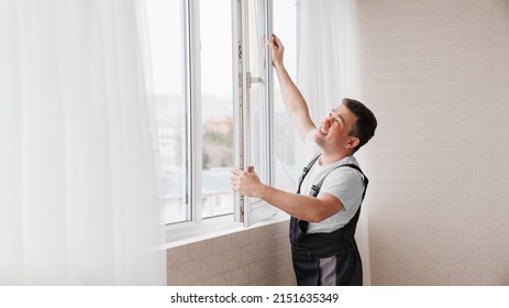 a repairman repairs, adjusts or installs metal-plastic windows in the apartment. glazing of balconies, loggias, verandas in house. production of double-glazed windows to individual sizes.