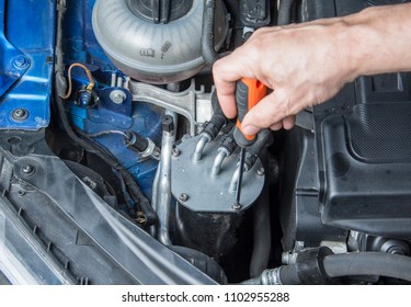 Repairman Starts To Change Fuel Filter In The Car