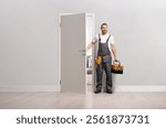 Repairman with a tool box arriving at a door 