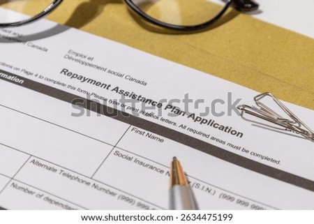Repayment Assistance Plan Application Form on Desk – Business Concept for Financial Relief
