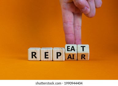 Repeat and repair symbol. Businessman turns wooden cubes and changes the word 'repeat' to 'repair'. Beautiful orange table, orange background, copy space. Business, repeat and repair concept.
