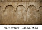 Repeating columns on a block wall in a medieval church in Rouen France