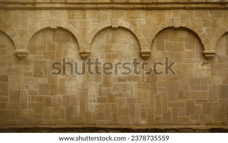 Repeating columns on a block wall in a medieval church in Rouen France