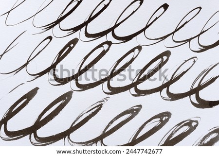 repeating cursive or calligraphic loops on blank paper