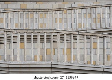 Repeating geometric pattern with railings on modern building facade design