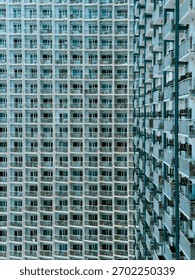 Repeating Grid Pattern Modern Residential Building Facade in Makati, Philippines
the highly repetitive, geometric grid created by the endless array of balconies and windows.