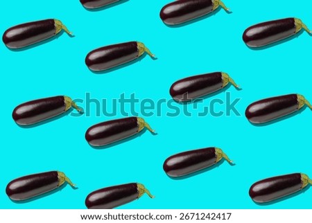 A repeating pattern of shiny eggplants arranged in diagonal rows on a turquoise background