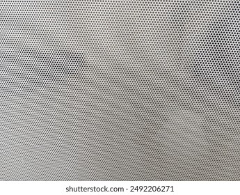 a repeating pattern of small dots on a surface
