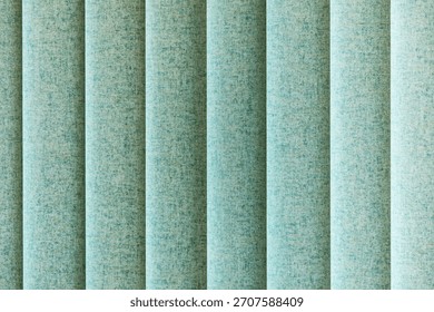 A repeating pattern of teal textured vertical panels yields a calm, contemporary backdrop. Ideal for interior decor, backgrounds, and design projects seeking a cool, architectural mood.