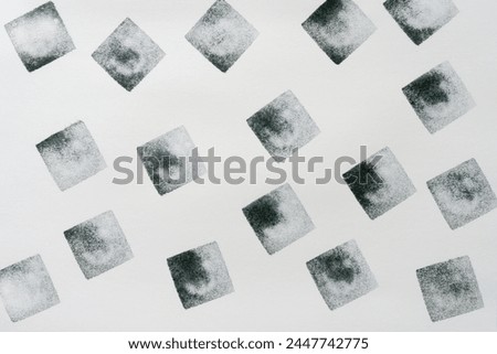 repeating square stamp pattern with gradient effect on paper