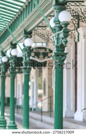 Repetitive green columns pattern with perspective lines minimal architecture background