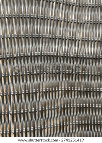 A repetitive pattern of intertwined strands