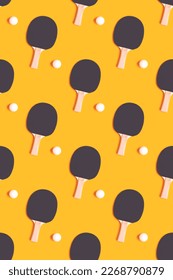 Repetitive pattern made of tennis racket and white ball on a yellow background. Ping pong concept. - Shutterstock ID 2268790879
