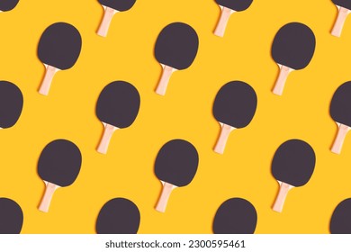 Repetitive pattern made of tennis racket on a yellow background. Ping pong concept. - Shutterstock ID 2300595461