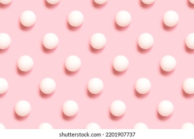 Repetitive pattern made white ping pong ball on a pink background. Creative layout. - Shutterstock ID 2201907737
