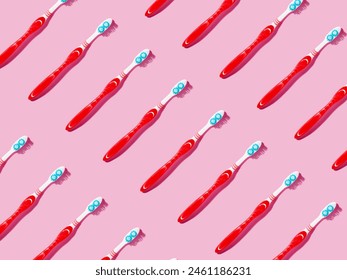 Repetitive pattern of toothbrushes on pink background. Top view.