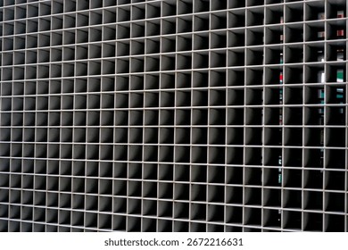 Repetitive square grid pattern on industrial architectural facade