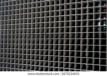Repetitive square grid pattern on industrial architectural facade