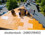 Replace old asphalt bitumen shingles on house roof in order to repair roof