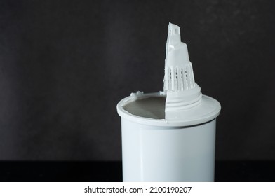 Replaceable Cutaway Water Filter Cartridge On A Dark Background