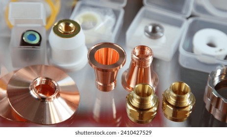 Replaceable details for laser cutting and welding machines - fittings and cones