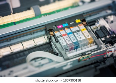 Replacement of CMYK set of ink cartridges in printer. - Shutterstock ID 1807300138