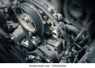 Replacement Timing Belt With Rollers On The Old Diesel Engine In A Car Service. Close Up. Blur Effect.