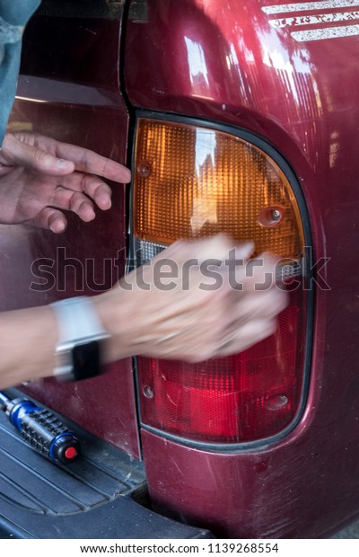 Replacing a burned\
out stop light on a\
vehicle