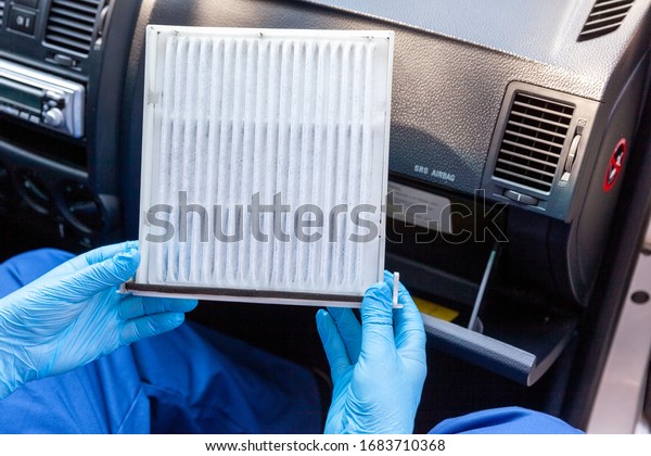 Replacing cabin pollen air filter for a car as\
prevention against coronavirus\
disease