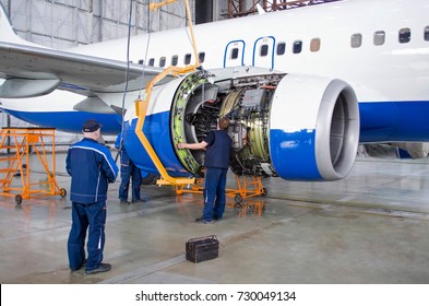 Replacing the engine on the airplane, working people. Concept maintenance of aircraft