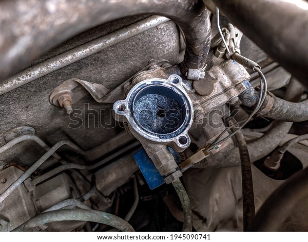 Replacing a heavily soiled old filter in\
the gas reducer. Maintenance of car gas\
equipment.
