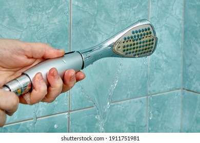 Replacing An Old Broken Shower Head In The Bathroom.