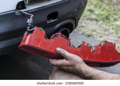 Replacing And Repairing The Turn Signal Taillight On A White Car. Headlight Repair Close-up