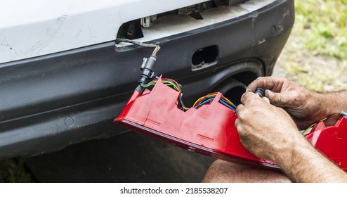 Replacing And Repairing The Turn Signal Taillight On A White Car. Headlight Repair Close-up