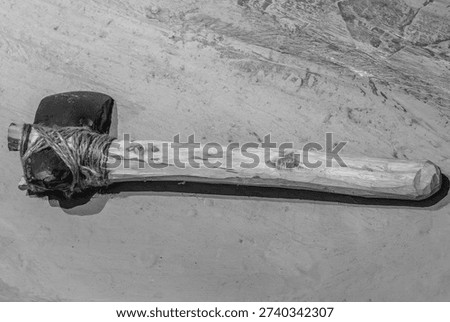 A replica of a hafted stone axe, an authentic example of a prehistoric tool