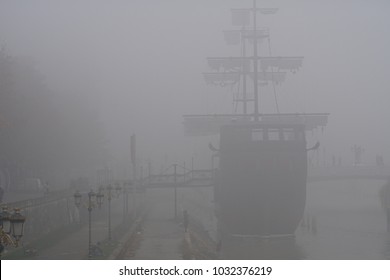 Replica Of Old Caravel Ship In The Middle Of Fog