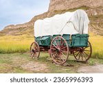 replica of pioneer covered wagon on prairie in Scotts Bluff National Monument, Nebraska