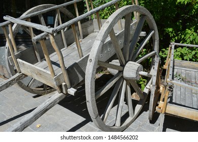 A Replica Of A Red River Cart Sitting On The Prairie