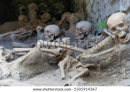 Replica skeletons in the position that the bodies were found after volcanic flow in 79AD Herculaneum Ercolana Campania Italy                                
