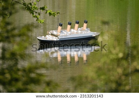 Replica of the Titanic in a local pond framed by trees. Halifax, Canada, May 2023