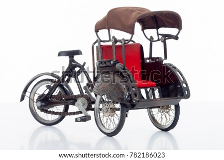 a replica of trishaw or rickshaw isolated with white background.