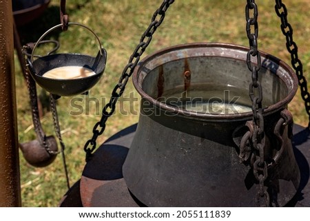 Replica viking cooking pots on display in a re-enactment village at a country fair
